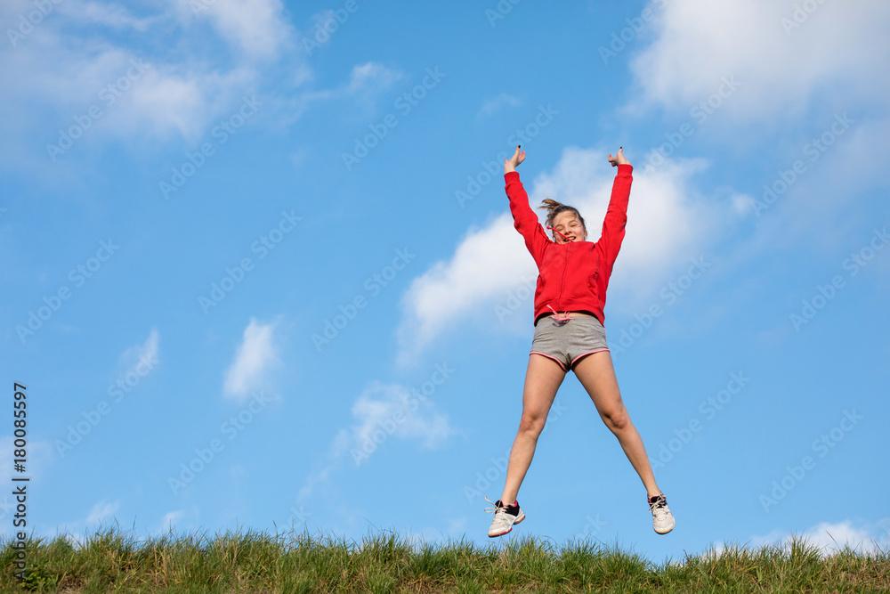 Success winner girl jumps
