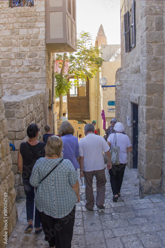 JAFFA, ISRAEL- OCTOBER16, 2017: Tourists and travelers to the stone streets of the ancient city of Jaffa, Israel photo