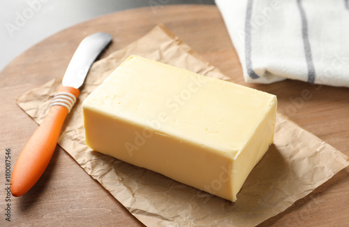 Fresh butter on wooden board, closeup