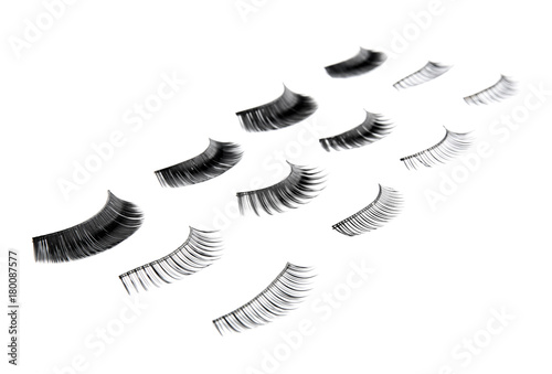 Different types of false eyelashes on white background