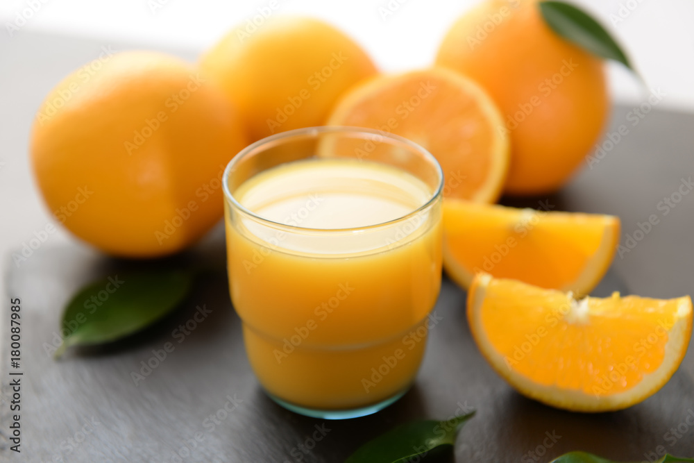 Glass of fresh orange juice on table Glass of fresh orange juice on table