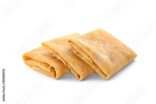 Delicious thin pancakes on white background