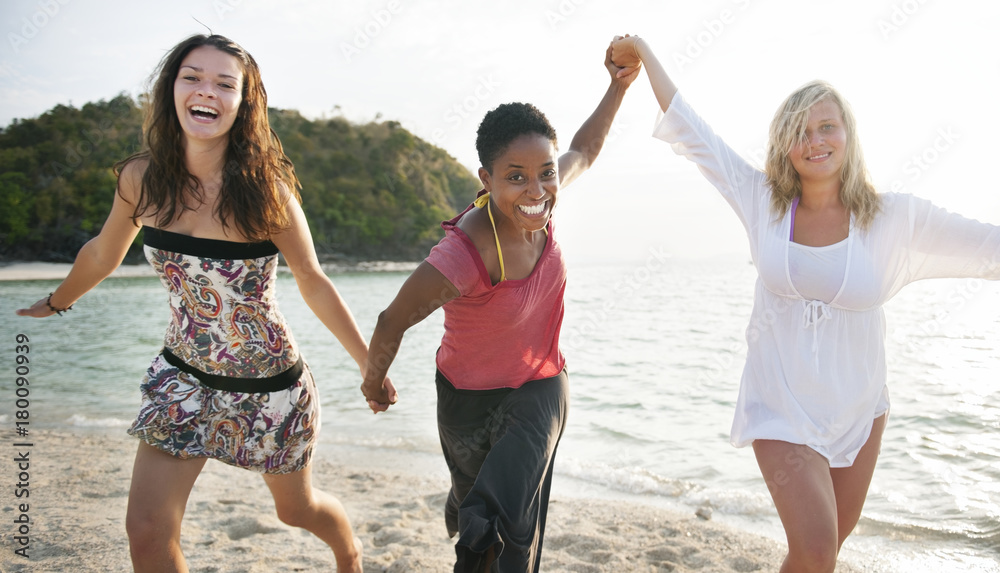 A group of diverse people is having fun at the beach A group of diverse people is having fun at the beach