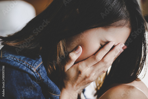 sad woman hug her knee and cry
