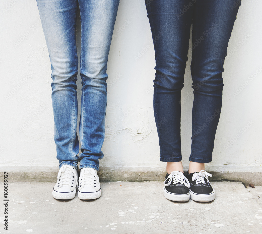 Closeup of pairs of legs in jeans Closeup of pairs of legs in jeans