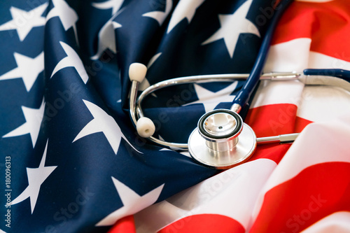 Close-up Photo Of Stethoscope On American Flag. medicine USA photo