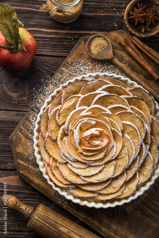 sweet autumn apple tart on wooden background