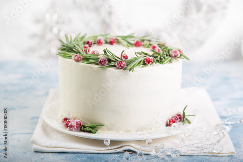 delicious festive gingerbread cake decorated with rosemary and sugar cranberries for Christmas