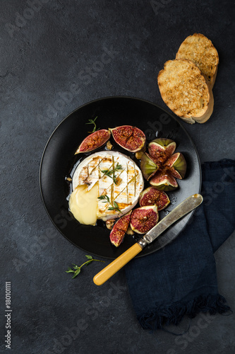 camembert cheese baked with  figs, nuts and honey photo