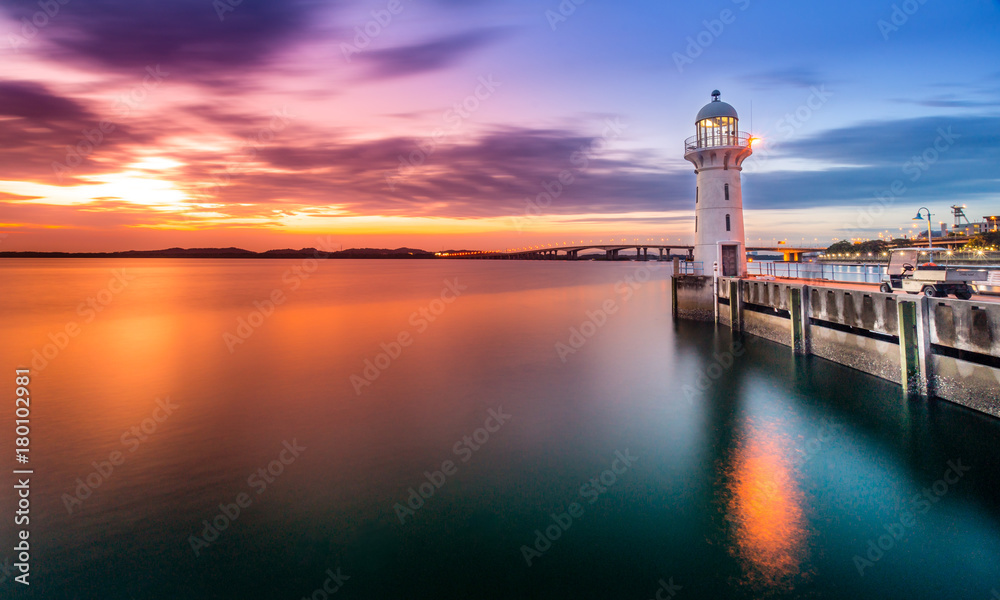 Lighthouse at Raffles Marina, during sunset Singapore