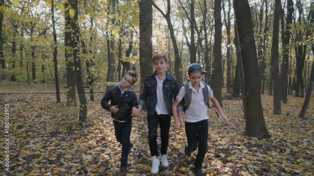 Children friends run in the forest on camera Children friends run in the forest on camera
