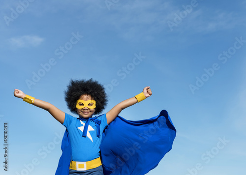 Girl with afro playing superhero