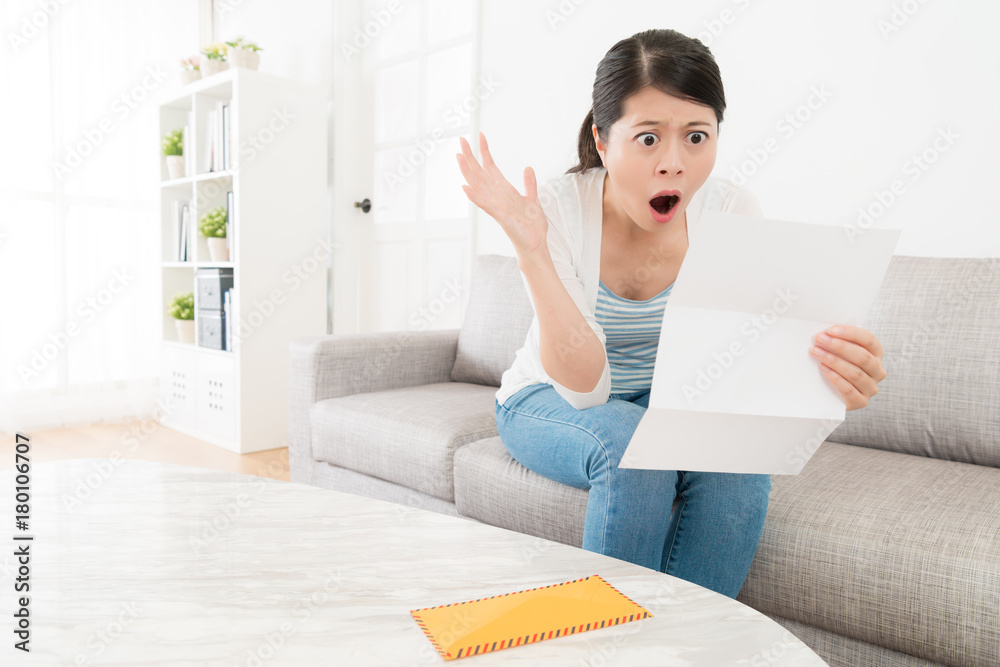 attractive young female teenager sitting on sofa attractive young female teenager sitting on sofa