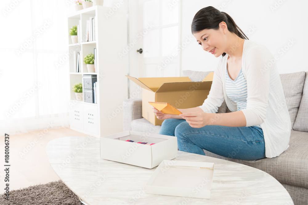 smiling elegant woman received present with letter smiling elegant woman received present with letter