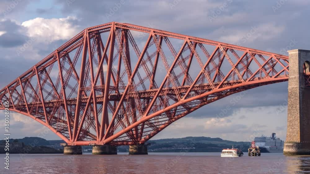 Panning Time-lapse of the iconic Forth Rail Bridge. Small boats passing by. South-Queensferry, near Edinburgh, Scotland, UK Panning Time-lapse of the iconic Forth Rail Bridge. Small boats passing by. South-Queensferry, near Edinburgh, Scotland, UK
