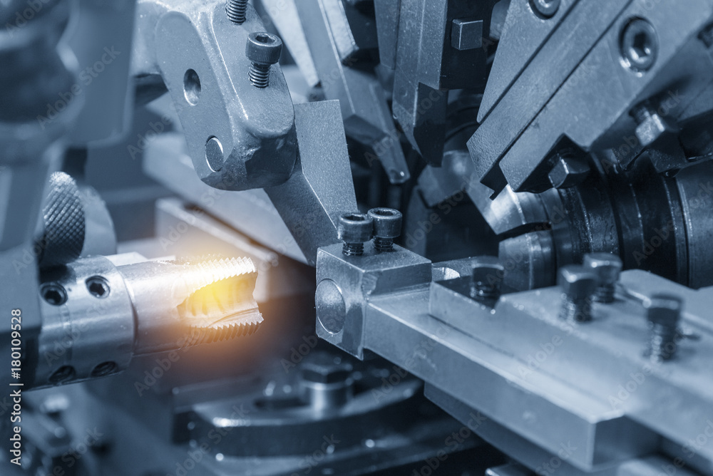 The tapping tool making machine in the light blue scene with the lighting effect. The tapping tool making machine in the light blue scene with the lighting effect.