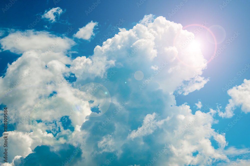 Bright blue sky with curly clouds background Bright blue sky with curly clouds background