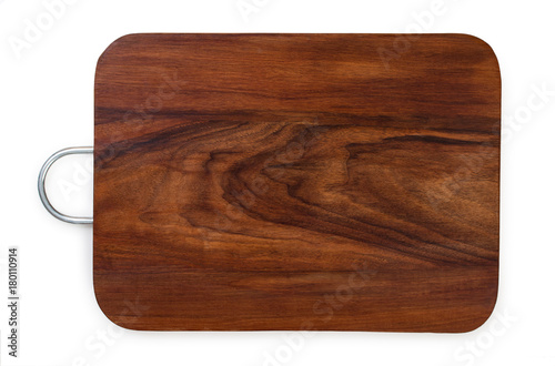 Handmade walnut wood cutting board with metal handle, isolated on a white background, top view.