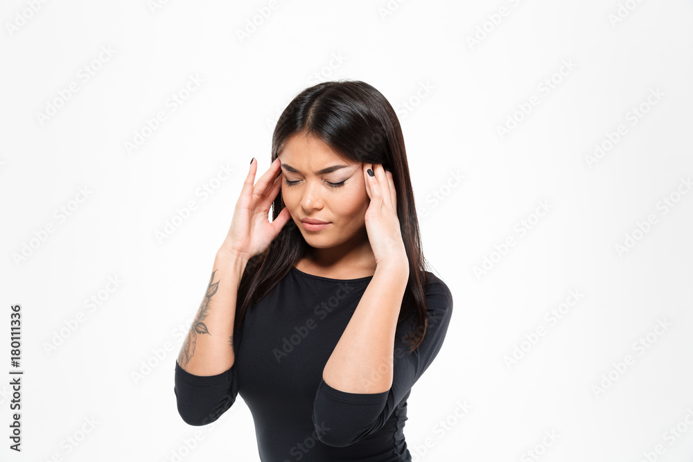 Close-up photo of frustrated asian woman having terrible headache, touching head Close-up photo of frustrated asian woman having terrible headache, touching head