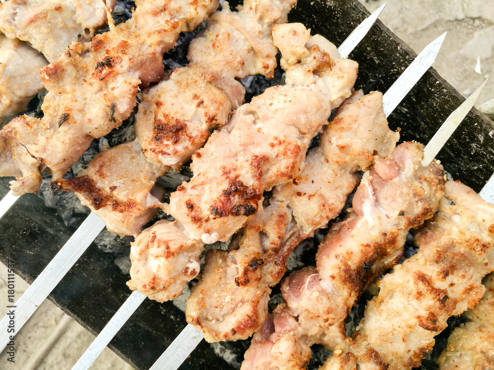 Shish kebab on metal sticks roasted on the grill