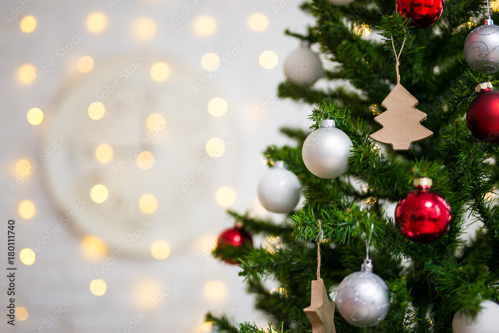 christmas background - close up of decorated christmas tree with balls and lights
