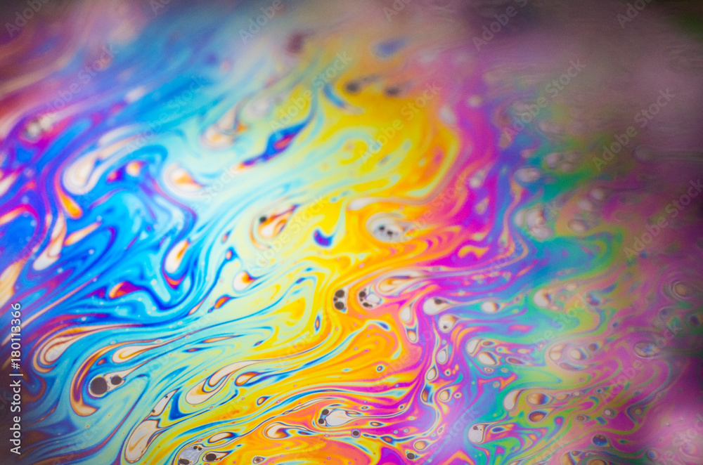 Beautiful psychedelic abstraction formed by light on the surface of a soap bubble