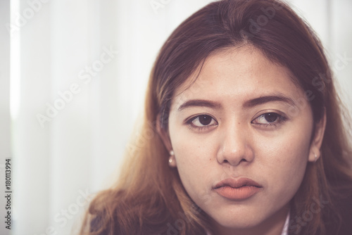 Close up sad beautiful asian woman from unrequire love,she think so much about boyfriend,life without love