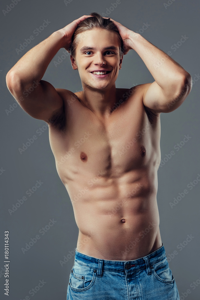 Handsome man on grey background Handsome man on grey background