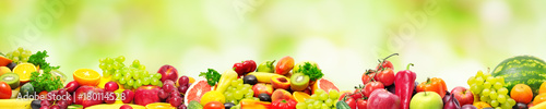 Panoramic collection fresh fruits and vegetables for skinali on blur green background.