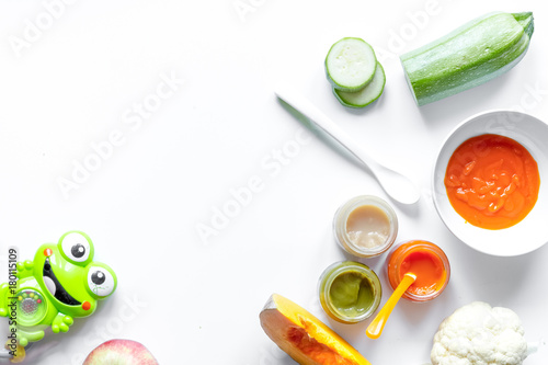 cooking vegetable puree for baby on white background top view
