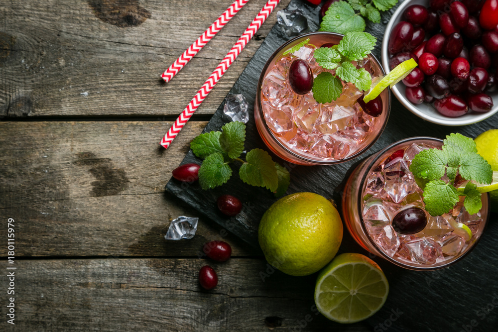 Cranberry mojito on rustic wood background Cranberry mojito on rustic wood background
