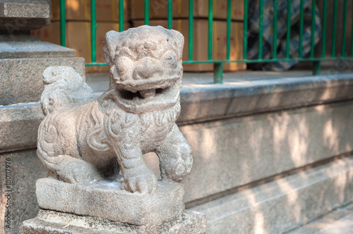 Stone lion outside Tin Hau Temple, Yaumatei, Kowloon photo