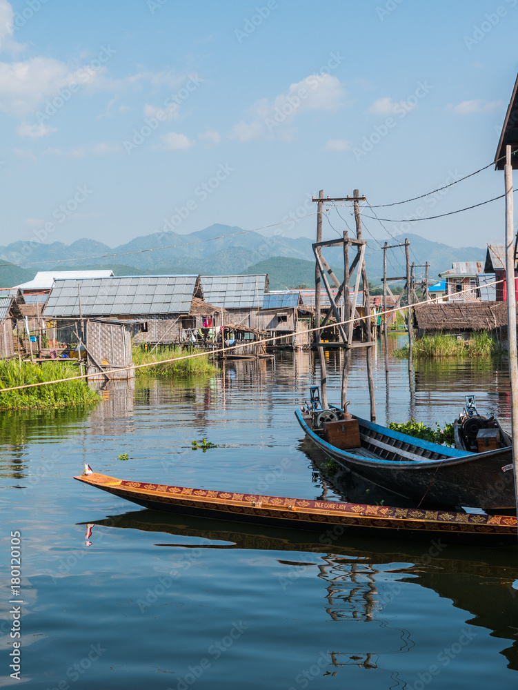 The village on wooden piles of Intha people living over water at Inle lake, Shan state, Myanmar The village on wooden piles of Intha people living over water at Inle lake, Shan state, Myanmar