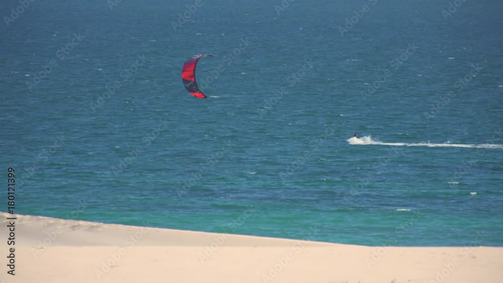 Kitesurfers surfing in the coast of spain near to africa Kitesurfers surfing in the coast of spain near to africa