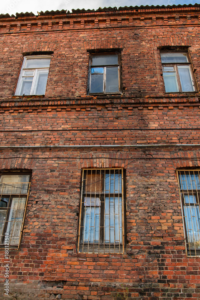 Facade of old red brick building in Vyborg, Russia