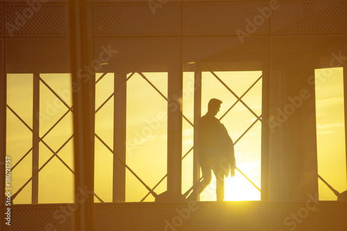 Travel concept, people in the airports ,Silhouette of travelers with luggage walking at airport,