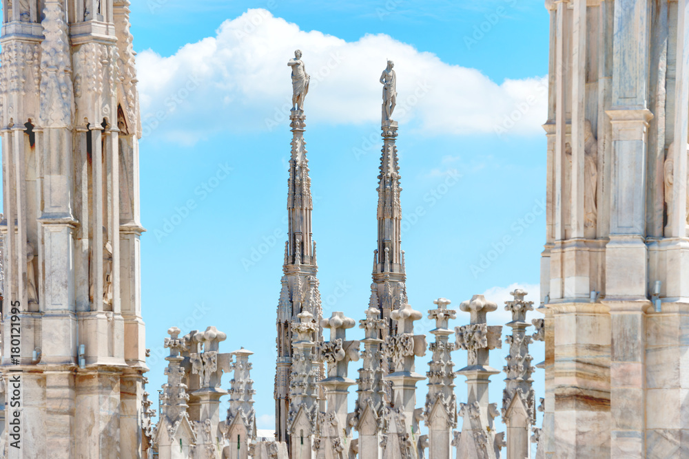 Statues on roof of Duomo Cathedral di Milano on piazza in Milan, Italy Statues on roof of Duomo Cathedral di Milano on piazza in Milan, Italy