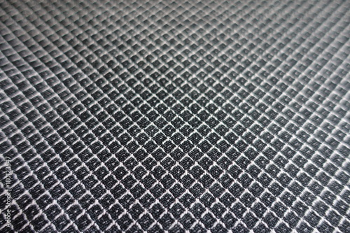 Close view of grey fabric with diamonds pattern