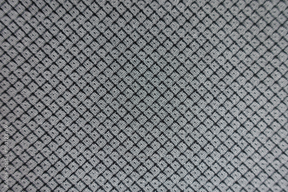 Symmetric pattern on grey viscose fabric from above Symmetric pattern on grey viscose fabric from above
