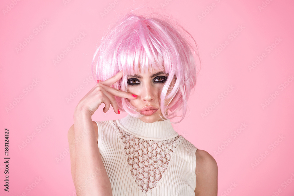 Woman wear pink wig hair on rosy background Woman wear pink wig hair on rosy background