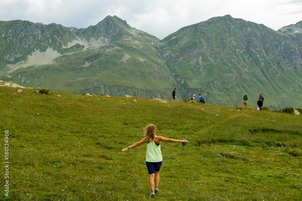 Girl running in Caucasus mountains, Abkhazia Girl running in Caucasus mountains, Abkhazia