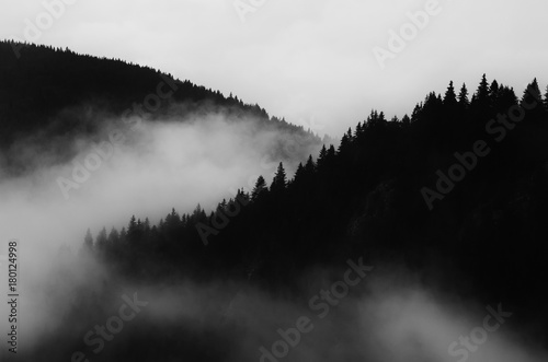 dark minimal landscape, black and white scenery with fog and mountains