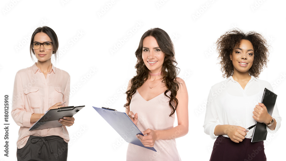 multicultural businesswomen with folders multicultural businesswomen with folders