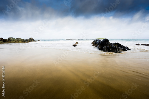 Obraz na plátně Stormy weather desert beach in Scotland iona isle