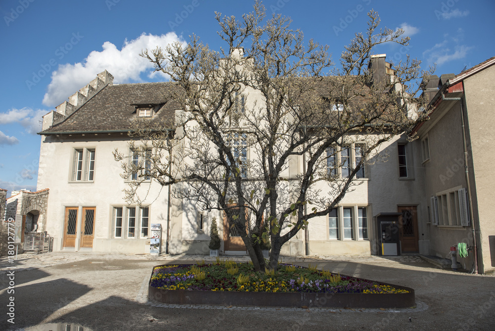 Old building on blue sky near Rheinfall - the biggest waterfall in Europe. Northern Switzerland, between the cantons of Schaffhausen and Zurich. Old building on blue sky near Rheinfall - the biggest waterfall in Europe. Northern Switzerland, between the cantons of Schaffhausen and Zurich.