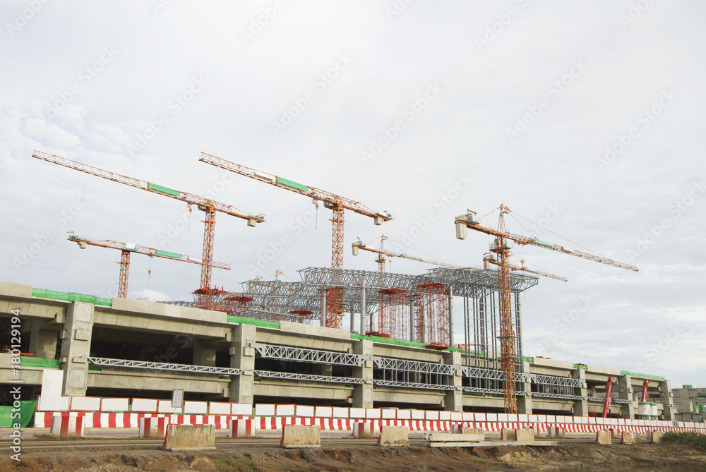 Large construction site with tower crane and blue sky