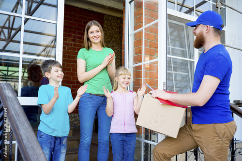 Delivery man delivering boxes photo