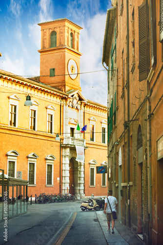 Ferrara, Italy - 22.06.2017 The streets of the historic Italian city of Ferrara, the ancient architecture, the man goes down the street