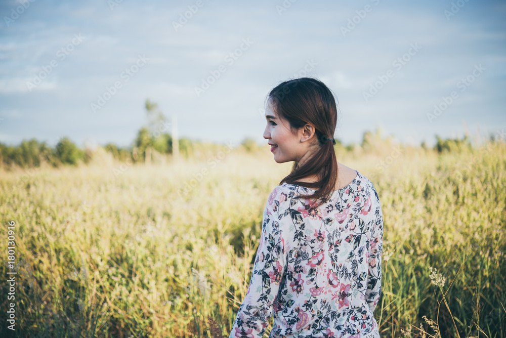 Asian woman feeling sad from unrequire love in the field.,breakheart girl concept,outdoor. Asian woman feeling sad from unrequire love in the field.,breakheart girl concept,outdoor.