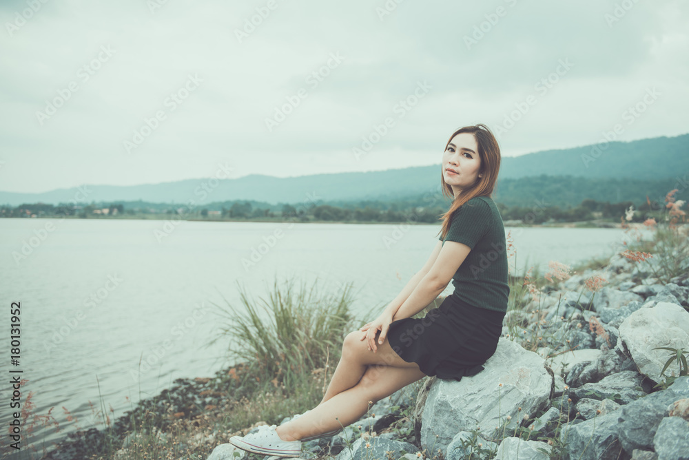 portrait of aisan woman feeling sad outdoor,heartbreak girl concept.